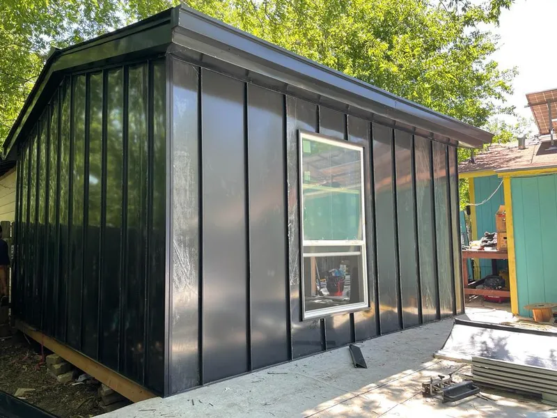 Black standing seam metal wall panels for Metal Roof Installation in Clinton